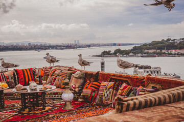 Great panoramic view of Istanbul from rooftop decorated traditional colorful ornamental pillows