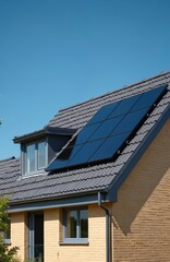 Fototapeta premium Modern home rooftop has dark solar panels installed under clear blue sky. New house construction integrates renewable green power tech. Sustainable energy generation for residential living.