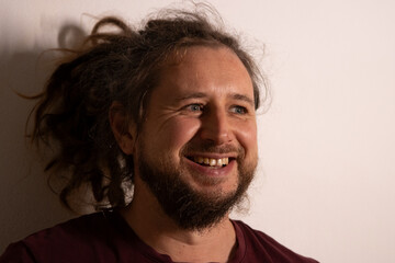 Happy man with beard smiling and laughing