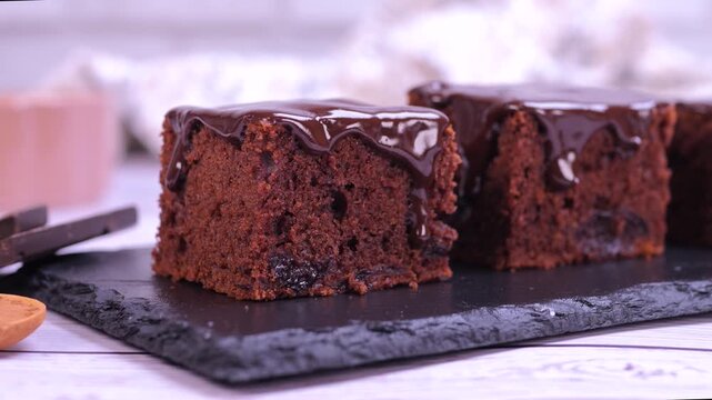 Delicious chocolate brownie dessert fork gently cuts in. Moist texture, rich chocolate details, appetizing presentation for culinary projects, food blogs, recipe videos, restaurant promotions.