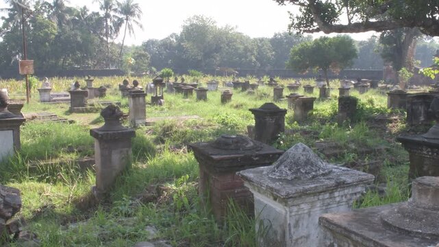 overgrown 18th-century 'jaffarganj' cemetery with ornate tombs and graves of the nawabs of bengal and their families at murshidabad, india