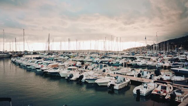 Wide view of a large, fully occupied marina with rows of small boats and yachts
