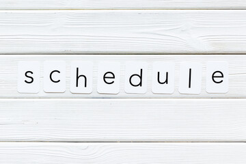 Paper cards with the text Schedule, top view.