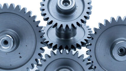 Metal gears interlocking in industrial engineering style in cool steel gray colors representing mechanical power transmission