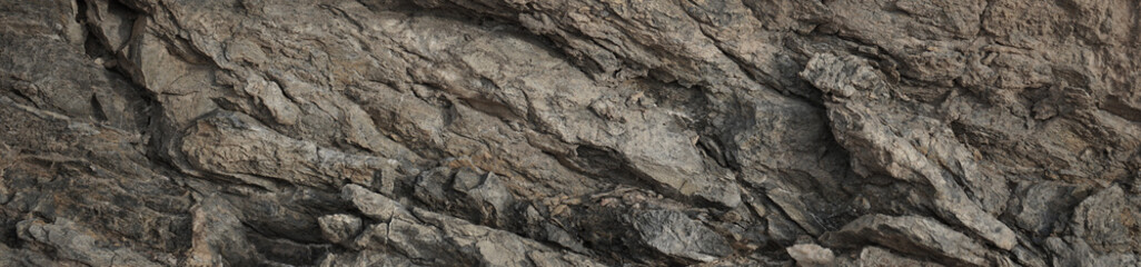 Light brown beige gray granite rock stone background. Mountain surface. Close-up. Cracked crumbled crashed weathered grunge. Nature. For design. Wide banner. Panoramic.