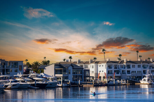 Boats and yachts docked on the Newport Bay at Marina Park in Newport Beach California USA - Powered by Adobe
