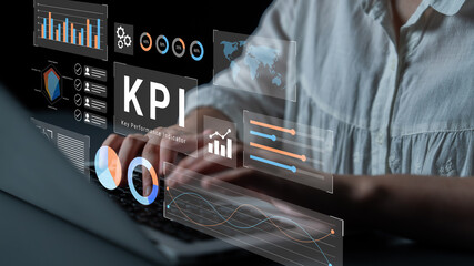 A professional is working on a laptop with various data visualization tools displayed, emphasizing the importance of data analysis in business decision-making. Gantry