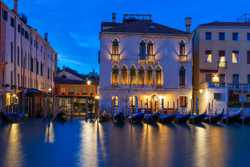 Night view of Grand Canal with gondola in Venice, Italy. Architecture and landmarks of Venice. © Ekaterina Belova