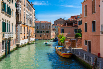 Narrow canal in Venice, Italy. Architecture and landmark of Venice. Cozy cityscape of Venice.