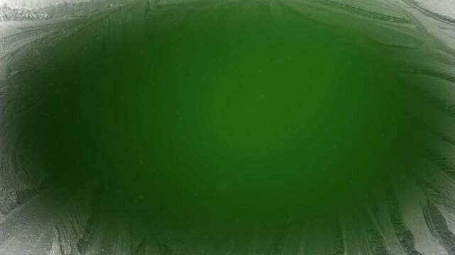 festive Christmas holiday snow and ice themed animated motion background with falling light snow gently falling over a dark green background with a white ice patterned border vignette frame border 4K