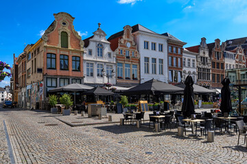 Grote Markt with tables of restaurants in Mechelen, Belgium. Mechelen is a city and municipality in...
