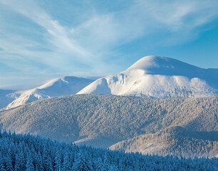 Sunrise and winter mountain landscape. View from Kukol Mount. (Carpathian Mountains, Ukraine)
