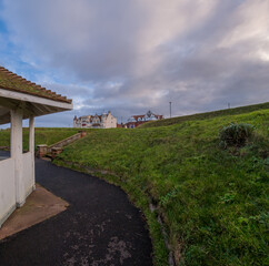 Wooden shelter on the clifftop path in the seaside town of Cromer on the North Norfolk Coast. Ultra wide angle view
