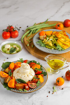 Gourmet Burrata Cheese Salad with Heirloom Tomatoes and Fresh Basil
