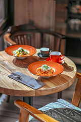 Delicious Italian Pasta with Parmesan and Fresh Greens, Restaurant Dining