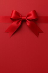 Luxurious Red Gift Box Background with Satin Ribbon Bow and Copy Space