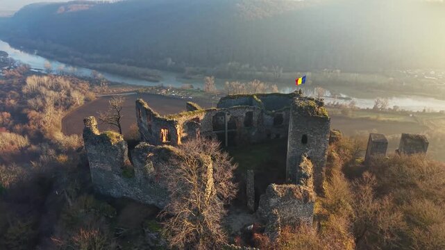 Scenic drone footage in late autumn over the Soimos Fortress in Arad County, Romania, Europe	