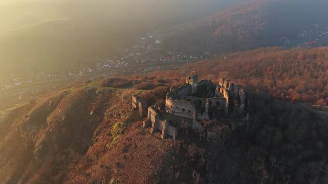 Scenic drone footage in late autumn over the Soimos Fortress in Arad County, Romania, Europe	