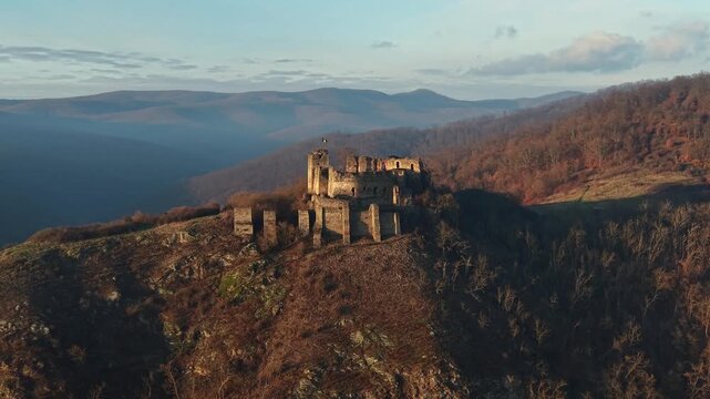 Scenic drone footage in late autumn over the Soimos Fortress in Arad County, Romania, Europe	