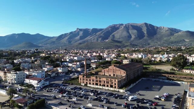Aerial view of Scauri beach with abandoned old factory construction along the coast 4