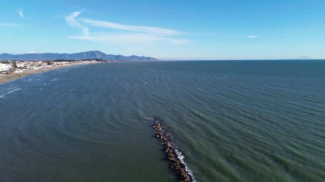 Aerial view of Scauri beach in winter empty of umbrellas on a windy coastal day 2