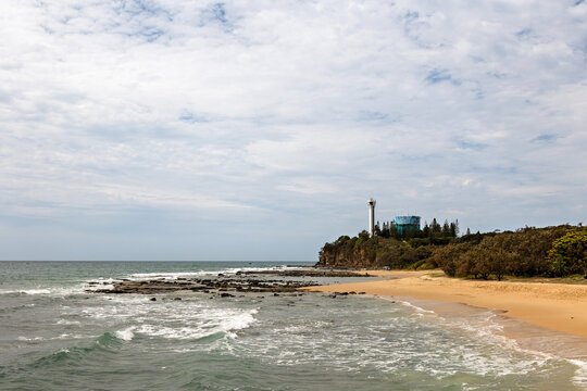 View along Point Cartwright Beach to the lighthouse at Buddina in Queensland Australia.