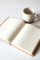 Blank Notebook and Ceramic Mug on White Surface
