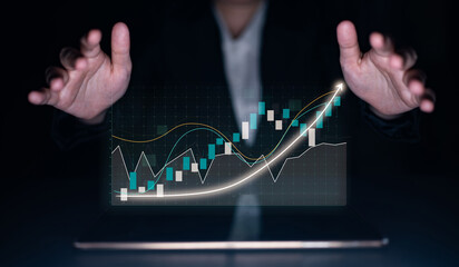 A businessman engages with digital financial graphs that showcase growth trends and data analysis, highlighting the intersection of technology and finance. Impute