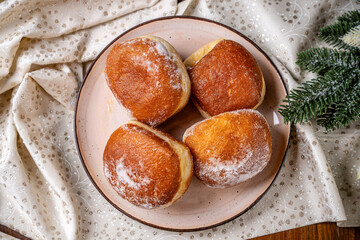 Traditional holiday donuts on festive tablecloth