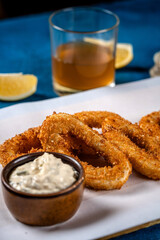 Golden crispy calamari rings with dipping sauce