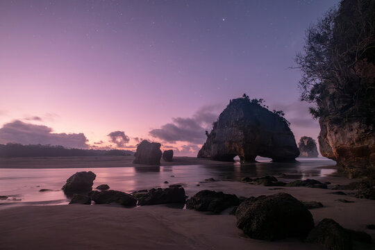 Dramatic limestone rock formations on Watu Maladong Beach at sunset, Sumba, East Nusa Tenggara, Indonesia