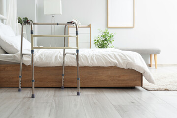 Medical walker on floor in bedroom