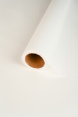 Soft roll of packaging paper in trending Cloud Dancer white airy, minimal and serene packaging canvas for floral design.