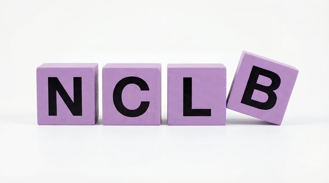 Four purple wooden alphabet blocks spelling out NCLB with the letter B tipping precariously to the right on a white surface against a white background letters education learning word