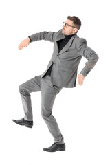 Young businessman in pose of marionette on white background