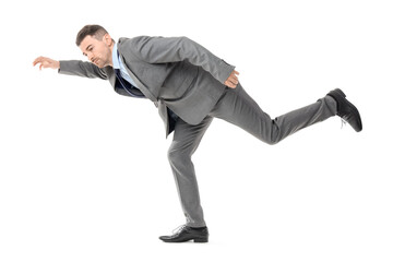 Businessman in pose of marionette on white background