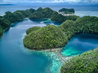 Aerial view of turquoise lagoons and forested islets in Siargao