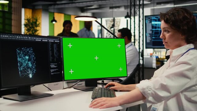 Isolated screen computer used by admin in office doing AI software development to launch new features. Chroma key PC used by worker in startup company writing artificial intelligence program, camera A
