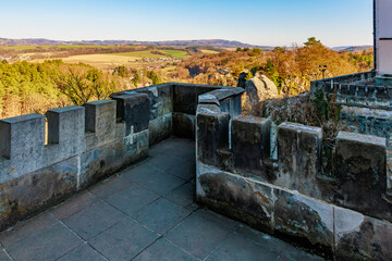 Fototapeta premium Scenic view from old stone fortress wall overlooking landscape in early spring