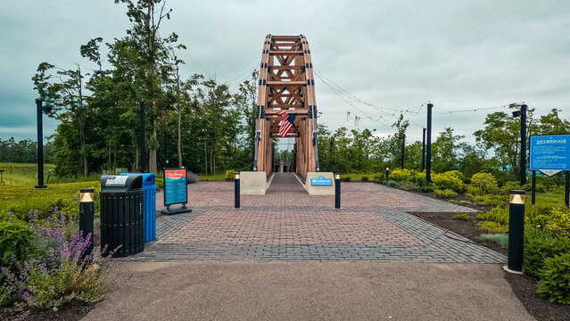 Boyne Falls, Michigan, USA, June 24, 2025 : The entrance to Skybridge a timber towered pedestrian suspension bridge at Boyne Mountain Resort. The world's longest timber-towered suspension bridge.