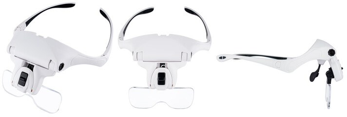 White magnifying glasses with multiple magnification levels for precision soldering of boards.