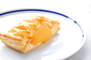 Delicious apple danish on the white plate
