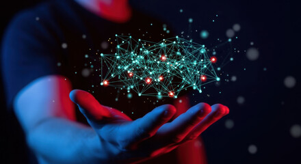 An outstretched hand presents a glowing digital network, illuminated with blue and red lights against a dark background, symbolizing technology and connection.