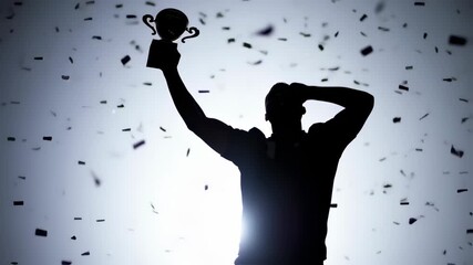 silhouette of champion raising trophy in confetti shower, celebration of success, victorious moment with falling confetti background, achievement
