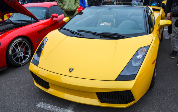 Yellow Lamborghini Gallardo Spyder supercar, Italian mid engine exotic car is renowned for its aggressive styling, powerful performance, and luxurious presence