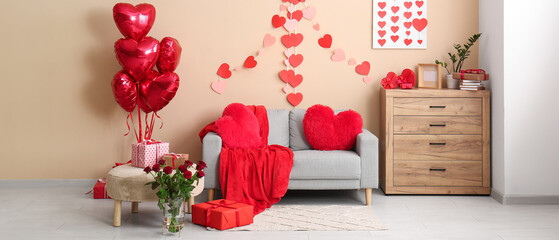Interior of stylish living room with grey sofa, roses and heart-shaped decorations. Valentine's Day...