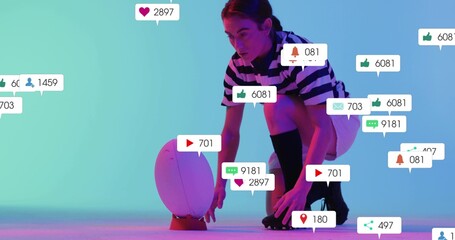 Crouching model in striped top, roller skates steadying egg on orange cone in studio with icons