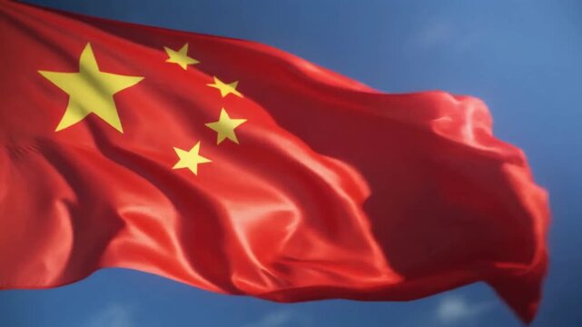 Red Flag with Yellow Stars: A vibrant red flag bearing five golden stars ripples gracefully against a clear blue sky, evoking a sense of national pride and cultural heritage.