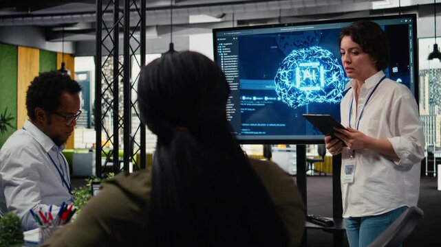 Tech startup office CTO doing presentation on machine learning technology to interested investors. IT specialist using display to show business stakeholders latest AI innovations, camera A