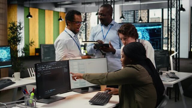 Team of software developers in office working together, automating workflows using AI. IT experts brainstorming to refine deep learning computational models for faster processing, camera A